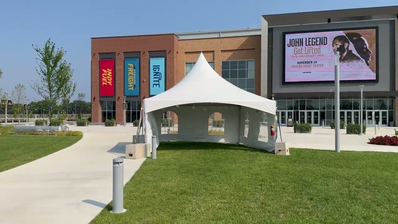 Tent with tables and chairs set up for a community distribution site in Indiana